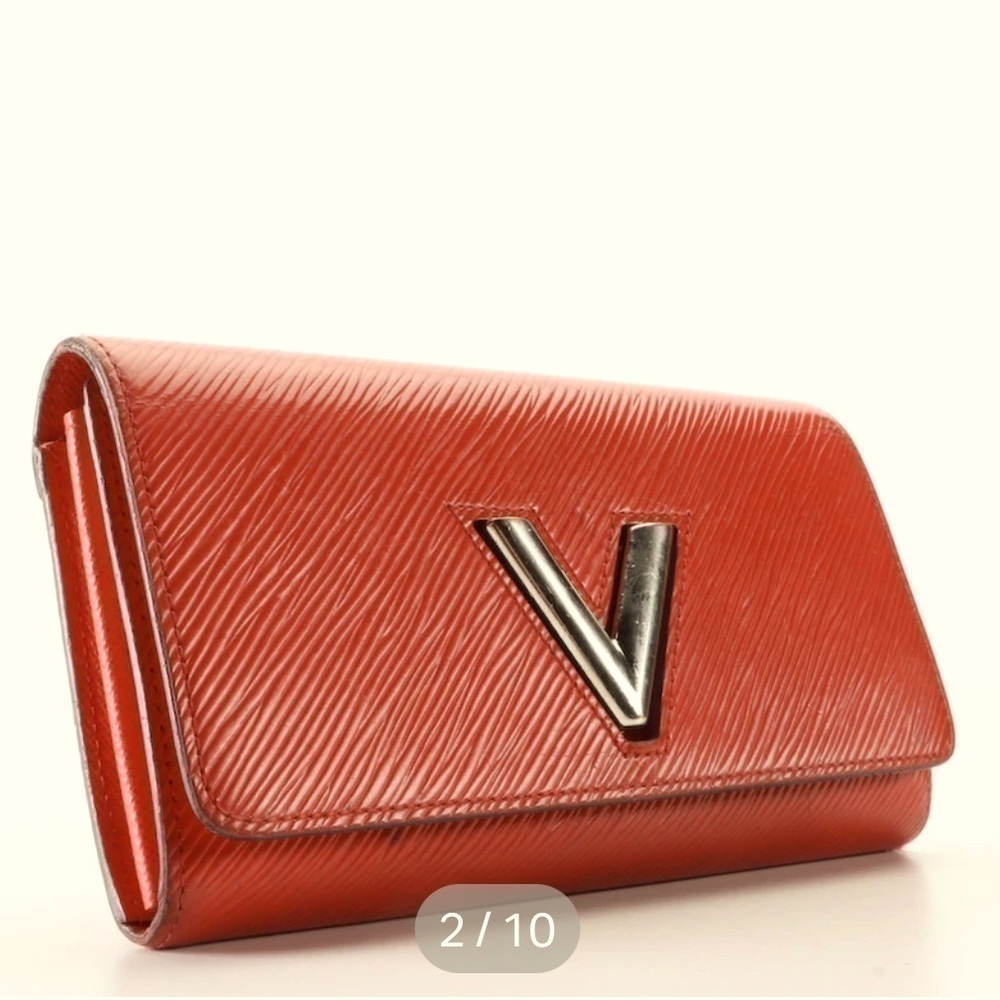Louis Vuitton red twist long wallet.